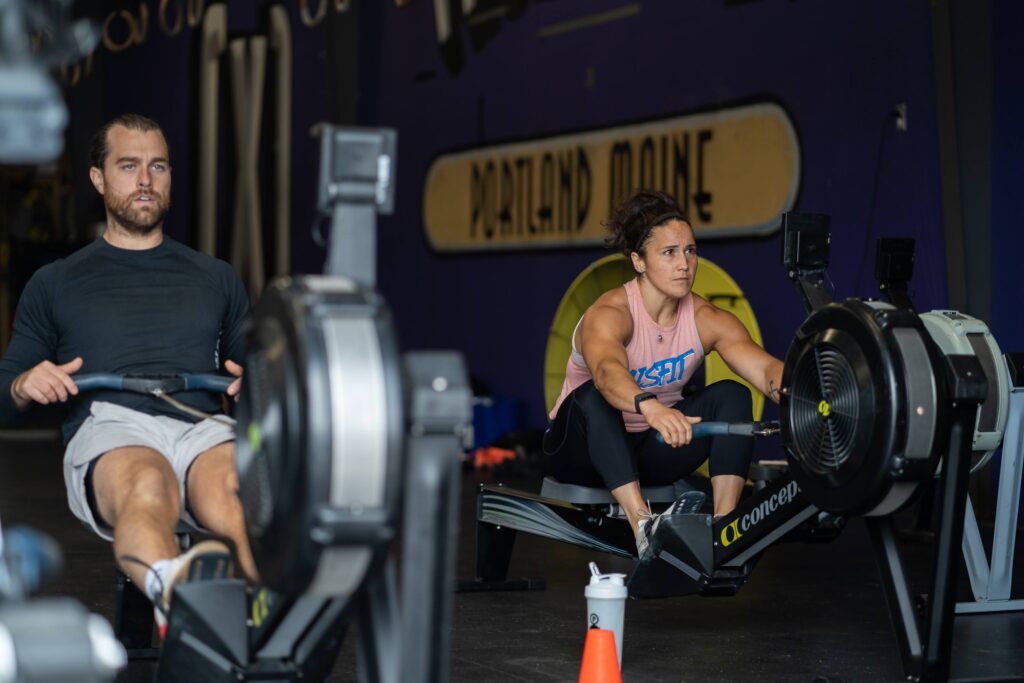 crossfit athletes rowing on concept 2 ergs